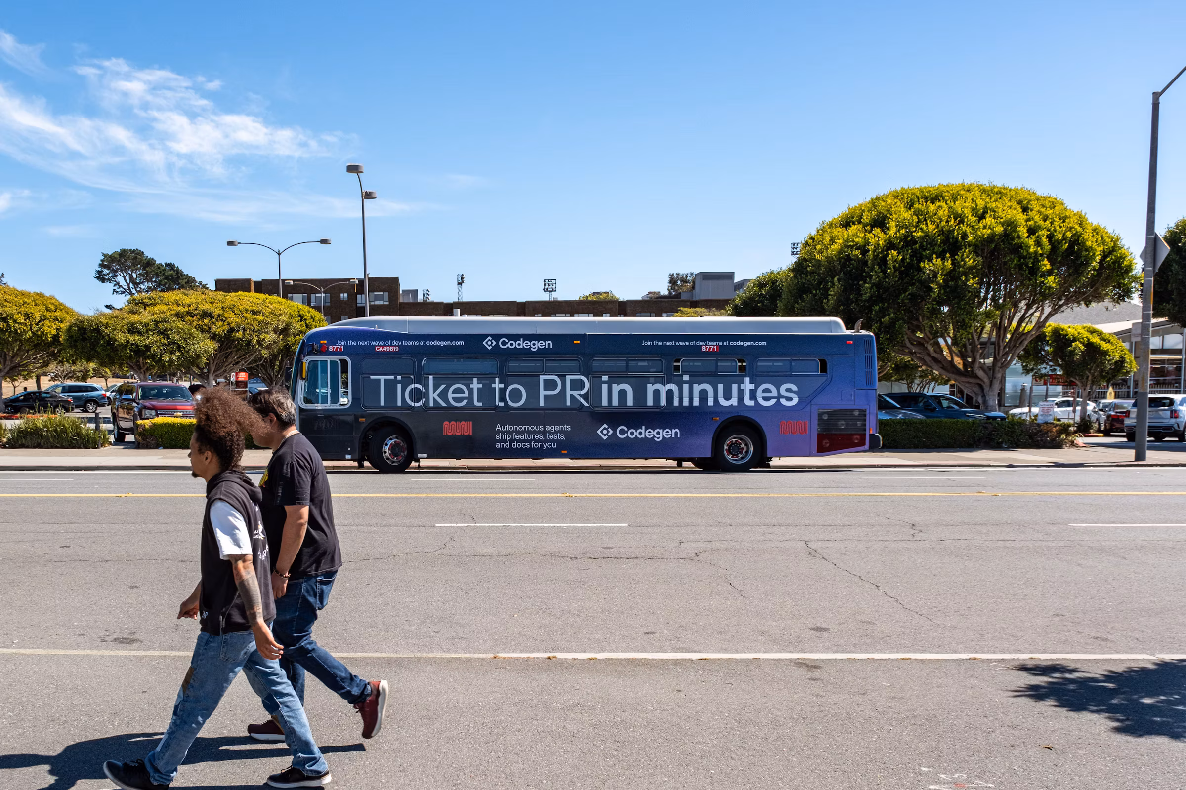 A city bus wrapped in the campaign - 'Ticket to PR in minutes' over a blue-to-purple gradient with the Codegen logo - as pedestrians cross a sunlit street.